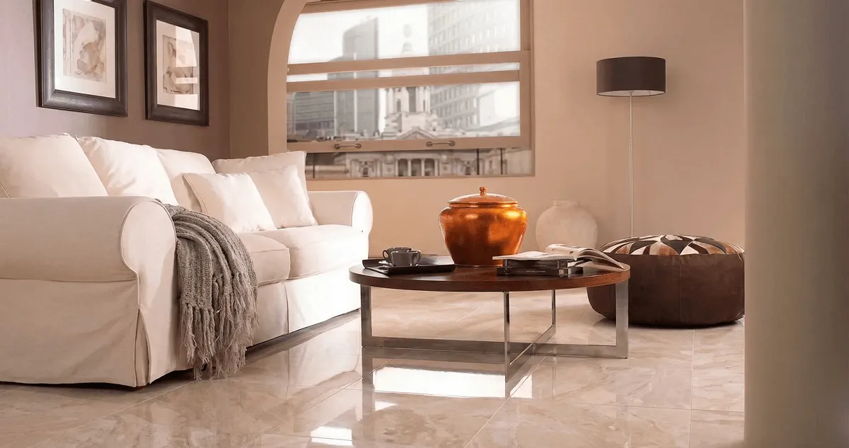 Modern living room with professionally installed marble flooring, a beige sofa, coffee table in Wilmington, NC