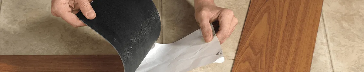 A professional installing vinyl flooring in Wilmington, NC